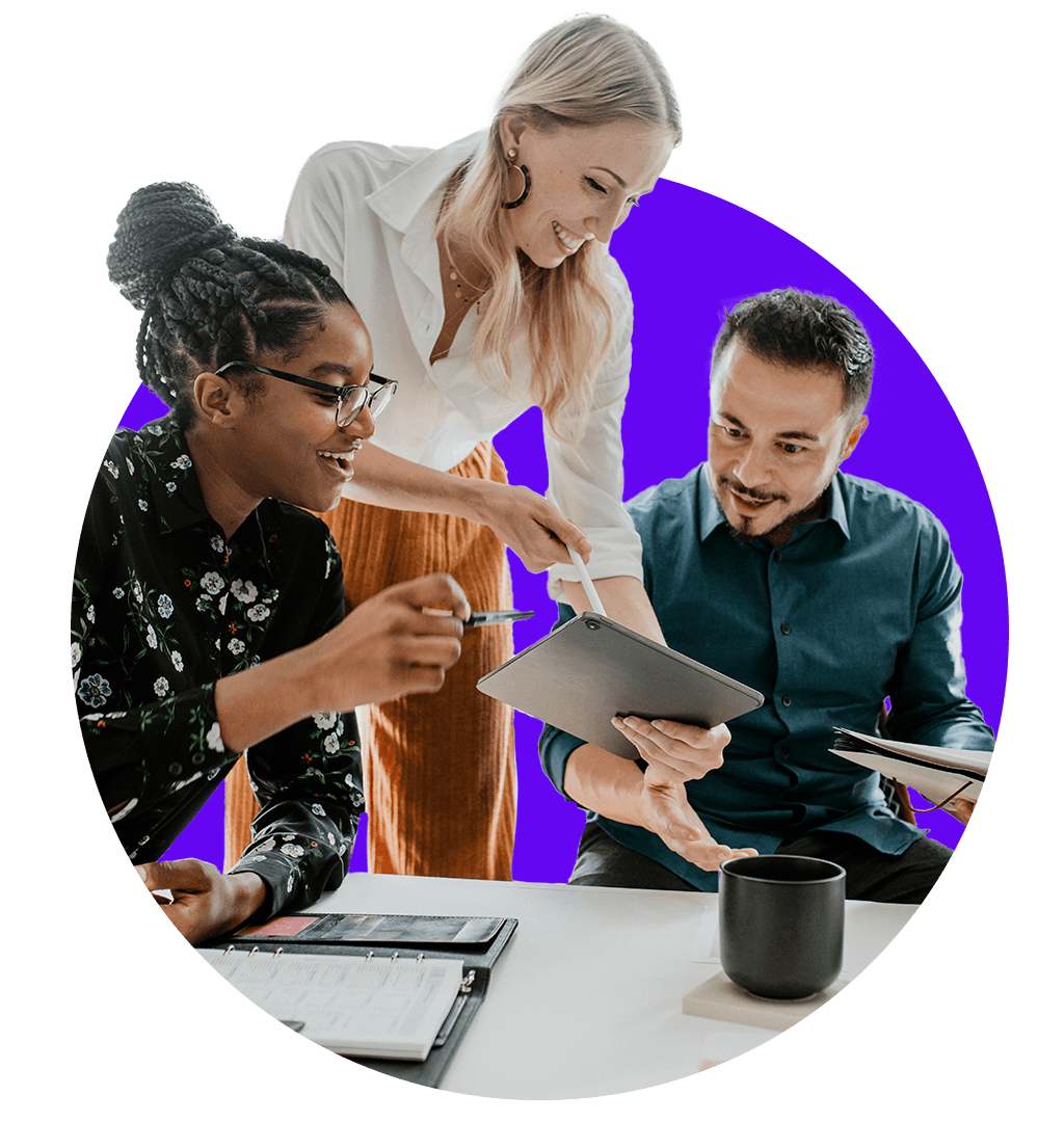 three people looking at a tablet and chating